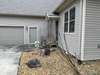 Garage entry with landscape pebbles for low maintenance