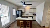 Kitchen open to dining area.  Gas stove cook top! New back kitchen door that leads to back deck