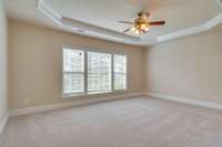 Your master oasis has a beautiful tray ceiling and brand new carpet!  