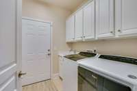 A separate Laundry room that you will absolutely love!  Plenty of storage and a utility sink.