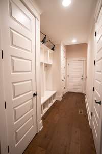 Hallway to stairs leading to bonus room. 