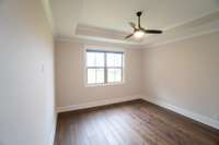 Bedroom 3 with hardwoods, black out shades & wood floors. 