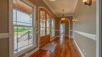 Entry Foyer!  Beautiful Teak Hardwood Floors.