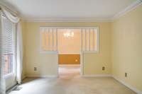 Living room and dining room with dental molding