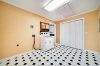 Laundry room with utility sink and large pantry