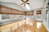 Sunroom is heated and cooled with great views of the private,  wooded acreage