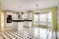 Eating area in Kitchen with bay window.