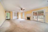 Family room has built in bookcases and a fireplace