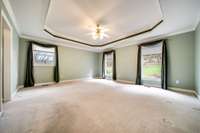 Master suite offers a lots of room and windows with a trey ceiling