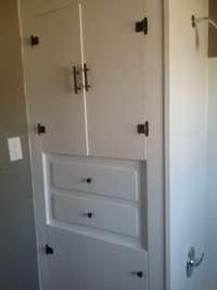 Get storage cabinets in main bathroom