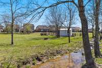 The creek that runs though the property can be weather dependent, but is a peaceful addition to the back yard.  