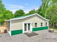 24x50 fully insulated shop with two 6x40 lean-to porches. Water and Electric.