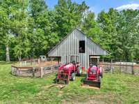 25x30 barn with hay loft and tack room. Water and Electric.