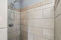 Tile shower in Primary on second level.