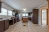 Large Kitchen with Stainless Steel Appliances and a built-in desk area.