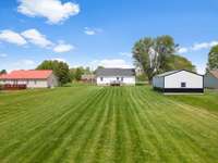 The well-manicured yard is flat