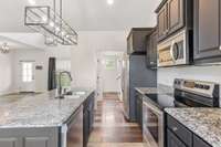 Granite countertops with fresh cabinets and stainless steel appliances