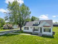 A bird's eye view brings out the well-kept yard and huge shade tree