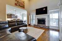 High ceilings and a gas fireplace compliment the living room