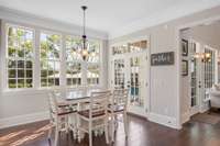 The natural light floods this home from that wall of windows spanning from breakfast nook to living room.