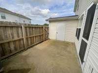 Extra large private fenced patio space.  Door leads to good sized storage area - ideal for bikes etc.