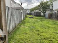 Patio opens to lots of green space.  Got a pet?  They will love to have this space to play.