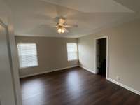 View of bedroom 1.  Notice the custom faux wood blinds here too.