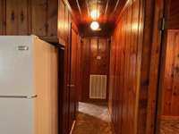 Hallway leading to the bedrooms, and bathroom.