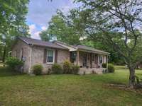 RELAX ON THE FRONT PORCH WHILE ENJOYING LIFE IN THE COUNTRY !