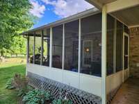 COVERED & SCREENED BACK PORCH FOR RELAXING & ENTERTAINING!