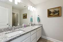 Full bathroom upstairs has so much space on the double vanity, also with beautiful granite.