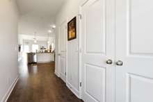 Entry foyer draws the eyes into the lovely living area.