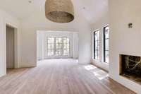 View from the primary bedroom to the sitting area, perfect for reading at the end of the day.