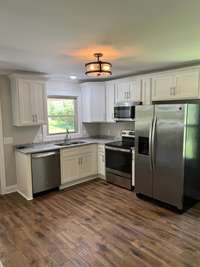 New cabinets and granite countertops + stainless steel appliances