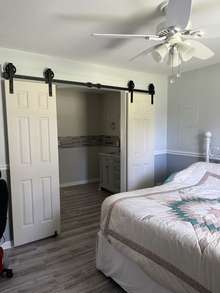 Bedroom 3 barn doors leading to beautiful master bath!