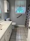 Main bath! Tile floors large counter space-tub/shower combo!