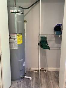 Water heater closet and extra storage!   Waster heater overflow drain extends to exterior of home-