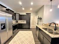 Access to garage and laundry room (photo is of model home with same floor plan)