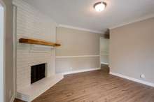 Added carpentry touches with chair rail and crown molding in living room, hallway and dining room.