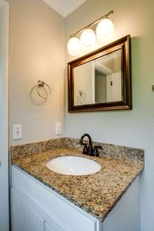 Half bath in the primary bedroom has also been fully renovated.