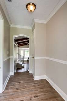 Entrance from back patio is the perfect space to create a mudroom/drop zone with a wall of hooks/cubbies. Closet can be used as pantry or additional storage closet.