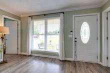 Large front window in the living room offers beautiful natural lighting.