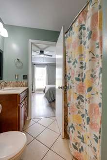 Shower/tub combo in master bathroom.