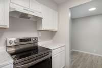 Kitchen with new stove, new Hood and new cabinets