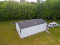 Garage with workshop has 10 foot doors and measures 24x40 feet.