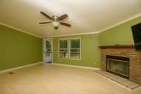 Fireplace and double windows in living room.