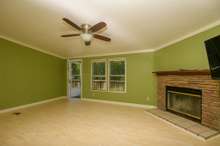 Fireplace and double windows in living room.