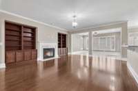 Fireplace and built-in bookshelves in living room.