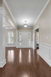 Looking from the sunroom back at the front doorway.