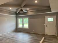 Living room with trey and coffered ceiling.